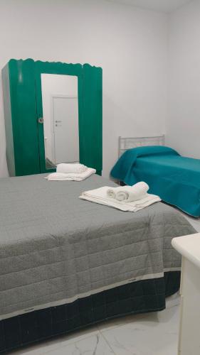 Giường trong phòng chung tại Casa Salemi 43