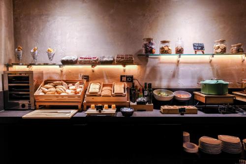 a kitchen with a bunch of food on a counter at Zenit Abeba in Madrid