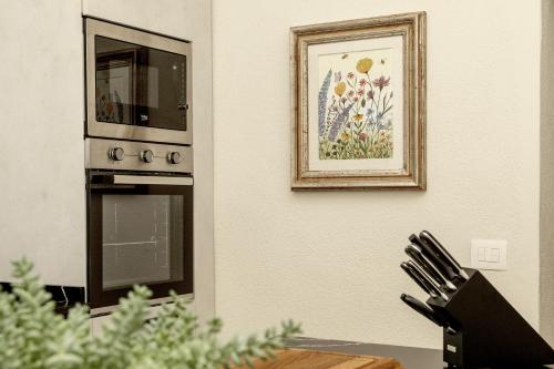 a picture hanging on a wall next to an oven at Stay in Chianti in Greve in Chianti
