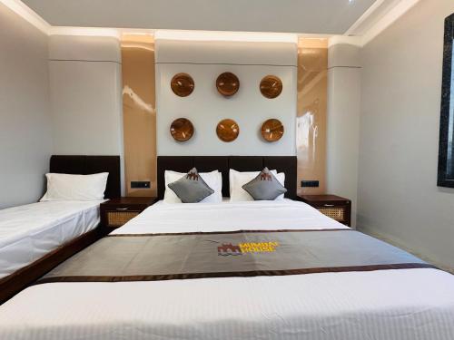 Postel nebo postele na pokoji v ubytování Hotel Mumbai House Pithampur