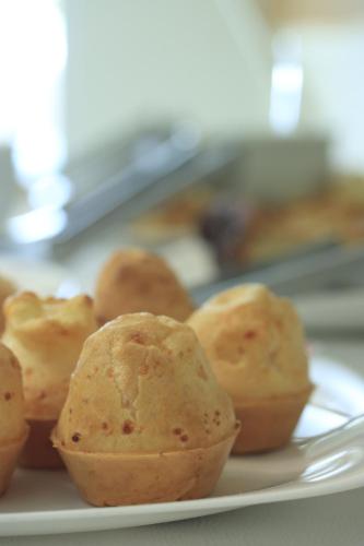 a plate of muffins sitting on a table at Hotel Brisa dos Abrolhos in Alcobaça