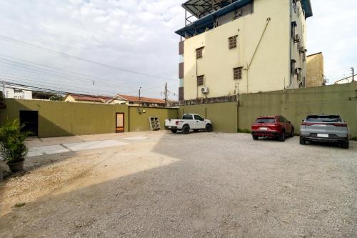 a parking lot in front of a building at Hotel Plaza Monte Carlo in Guayaquil