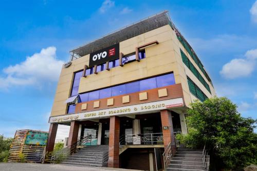 a building with stairs in front of it at Hotel O Silver Sky in Gulbarga