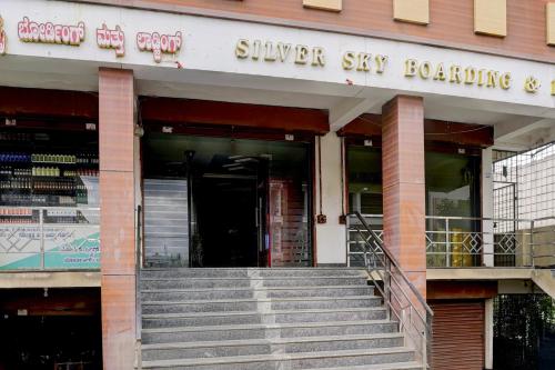 a building with stairs in front of a store at Hotel O Silver Sky in Gulbarga