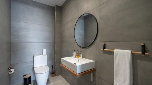 a bathroom with a white sink and a mirror at Villa Nero by LovelyStay in Funchal