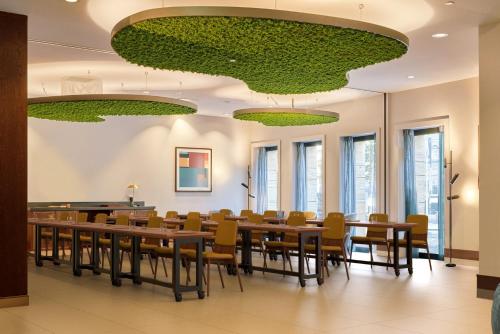 a conference room with a long table and chairs at voco The Hague by IHG in The Hague