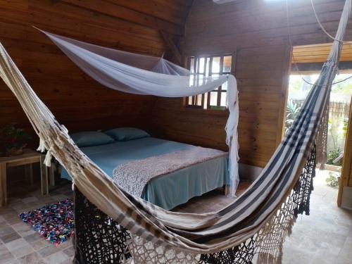 Postel nebo postele na pokoji v ubytování Hébergement rural Irakomby, trois chalets cosy