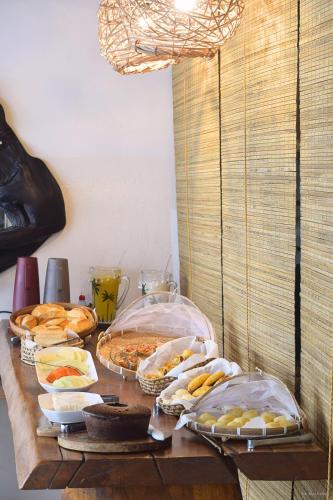 a table topped with lots of different types of food at Quadradinho de Trancoso in Trancoso