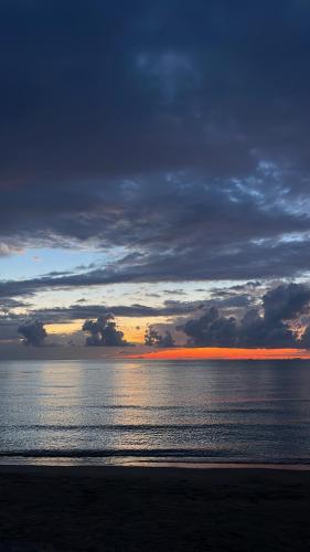 a sunset over the ocean with a cloudy sky at House for rent Jurgen in Golem