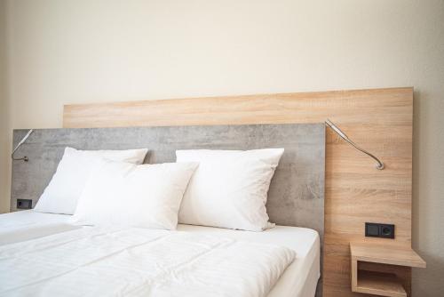 Postel nebo postele na pokoji v ubytování Hotel Hollmann