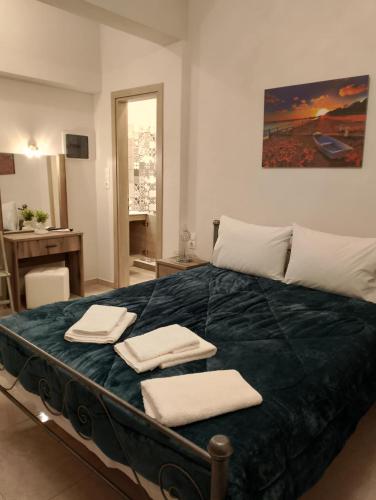 Ένα ή περισσότερα κρεβάτια σε δωμάτιο στο Agia Kiriaki rooms