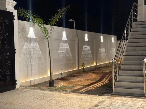 a wall with lights on it next to a staircase at Le Park Luxury Resort - TIE Hotels & Resorts in Puducherry