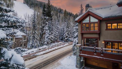 a house in the snow with a road at Chalet Bello in Beaver Creek
