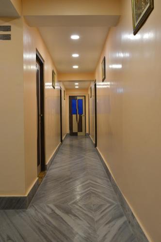 a corridor in a hotel with a long hallway at Hotel Golden Sunrise & Spa in Pelling