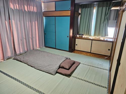 a small room with a bed and a window at Mogamigun - House - Vacation STAY 20213 in Shinjo