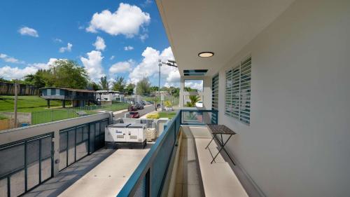 a balcony with a view of a street at Aquaville Dorado Moderna Villa 3 in Dorado