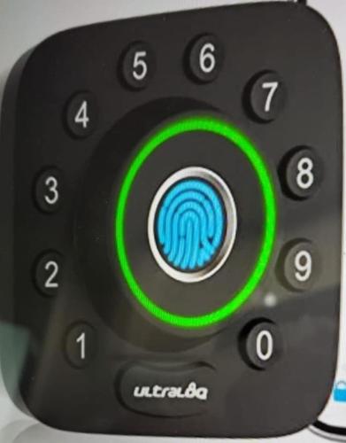 a remote control with a green circle on it at Aquaville Dorado Moderna Villa 3 in Dorado