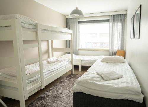 Letto o letti in una camera di The Luxury Downtown Rovaniemi with sauna