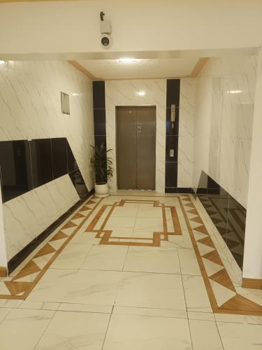 a hallway with a door in a building at 1 bedroom BNB Meru in Meru
