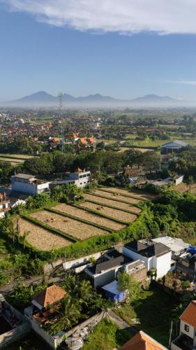 an aerial view of a city with buildings and fields at Niva Sanctuary - Family Friendly 2BR Villa with private pool - Between Sanur & Ubud in Ketewel