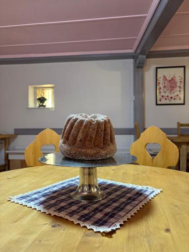 a chocolate cake on a plate on a table at Relais du Dompeter in Molsheim