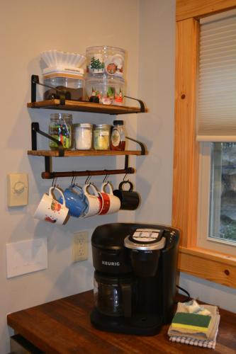 a kitchen with a coffee pot on a table at Cozy cabin with boosted Wi-Fi in Beech Mountain