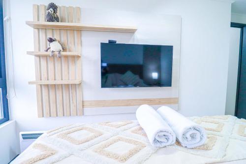 Postel nebo postele na pokoji v ubytování HOM I Vista Parcial al lago 2D2B