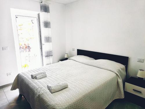 a bedroom with a bed with two pillows on it at Eden Home just a few minutes from Lake Maggiore in Gravellona Toce