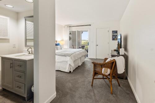 a bedroom with a bed and a sink at 1806 Heron Point in Summerville