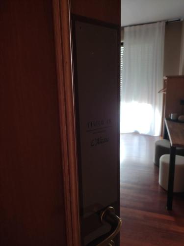 a door to a room with a living room at Civico 48 in Vizzola Ticino
