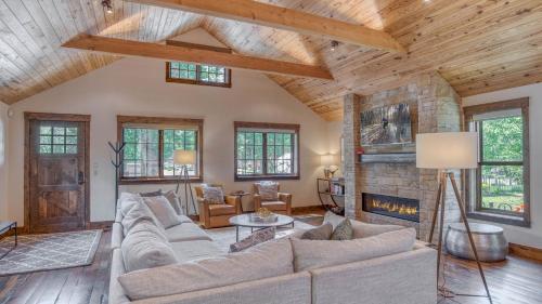 a living room with a couch and a fireplace at Harris House in Breckenridge