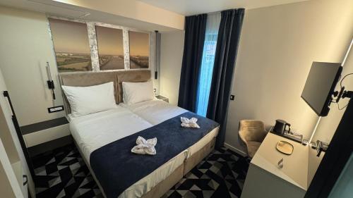 Postel nebo postele na pokoji v ubytování Hotel Modriča