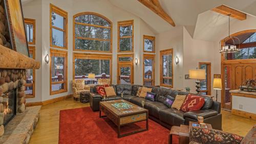 a living room with a couch and a table at Inglenook in Breckenridge