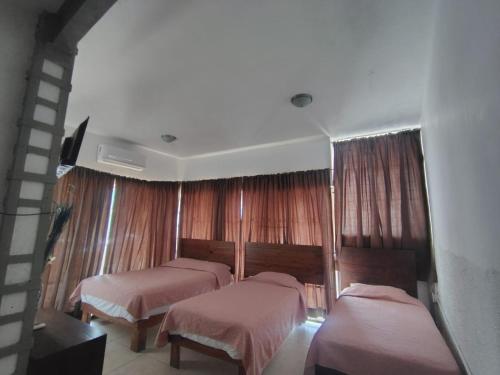 Postel nebo postele na pokoji v ubytování Acapulco Amor