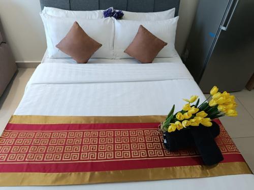 a bedroom with a bed with flowers on it at The Luxe & Colony Infinitum KLCC by CoupleStay in Kuala Lumpur