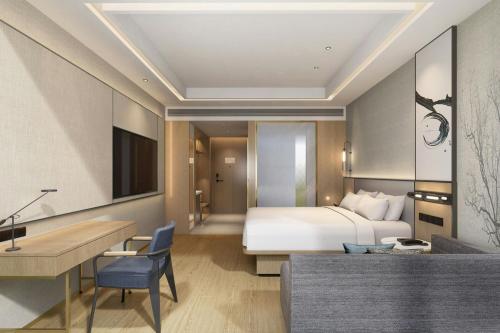 Giường trong phòng chung tại Fairfield by Marriott Qingdao West Coast