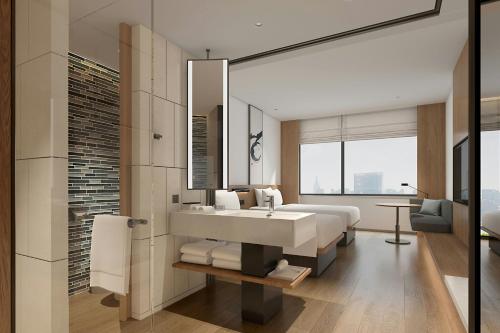 Postel nebo postele na pokoji v ubytování Fairfield by Marriott Xiong'an