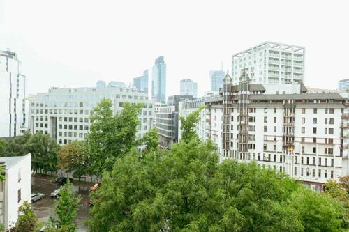 a city skyline with tall buildings and trees at City Vibes Warsaw Sienna by P&M in Warsaw