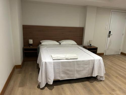 a bedroom with a large bed with two towels on it at Amazon Seasons hotel in Belém