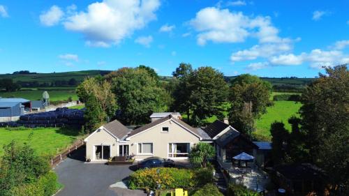an aerial view of a house in the countryside at Apartment in the Heart of Kerry in Knockeen Cross Roads