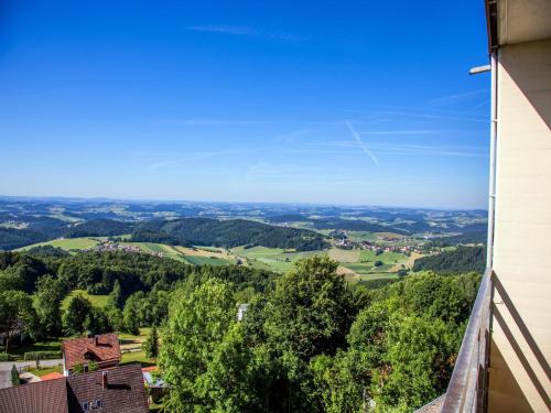 a view of the countryside from the balcony of a house at Inviting apartment in Freyung with sauna & indoor pool in Freyung