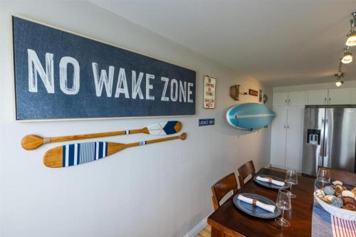a dining room with a no wake zone sign on the wall at Harbor Town Inn, BW Signature Collection in Manitowoc