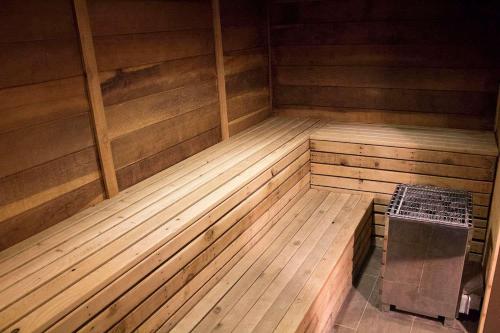 an empty wooden sauna with a bench in the middle at Mammoth Point #129 - Balcony with Mountain Views in Mammoth Lakes