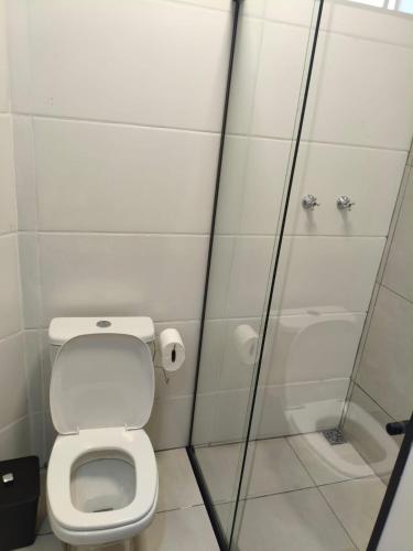 a bathroom with a toilet and a shower at Xavi Studio in Bauru