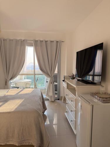 Ένα ή περισσότερα κρεβάτια σε δωμάτιο στο Union Suítes