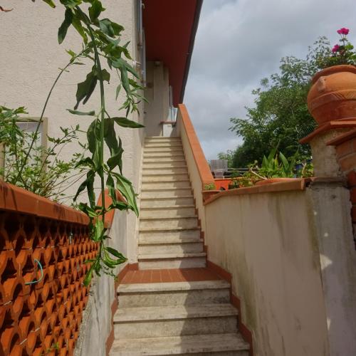 a set of stairs leading up to a house at Casa in collina, vista mare. in Nibbiaia