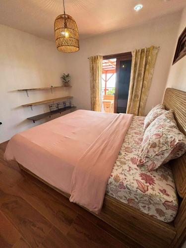 Ένα ή περισσότερα κρεβάτια σε δωμάτιο στο Mard Beach House Siquijor