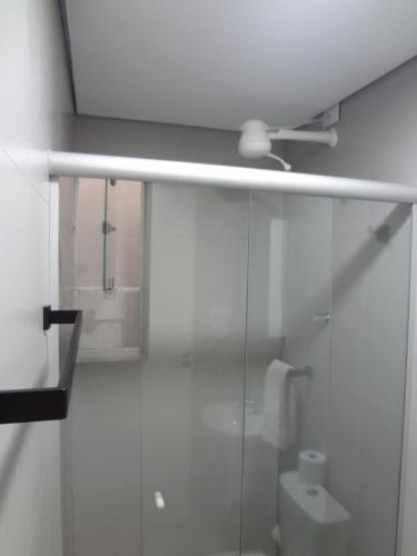 a bathroom with a toilet and a ceiling fan at WeStay Nova Cidade in São Paulo