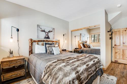 a bedroom with a bed and a dresser in a room at Take A Break In Breck in Breckenridge