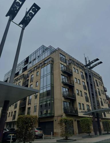 a tall building with a lot of windows at Custom House Square Penthouse in Belfast